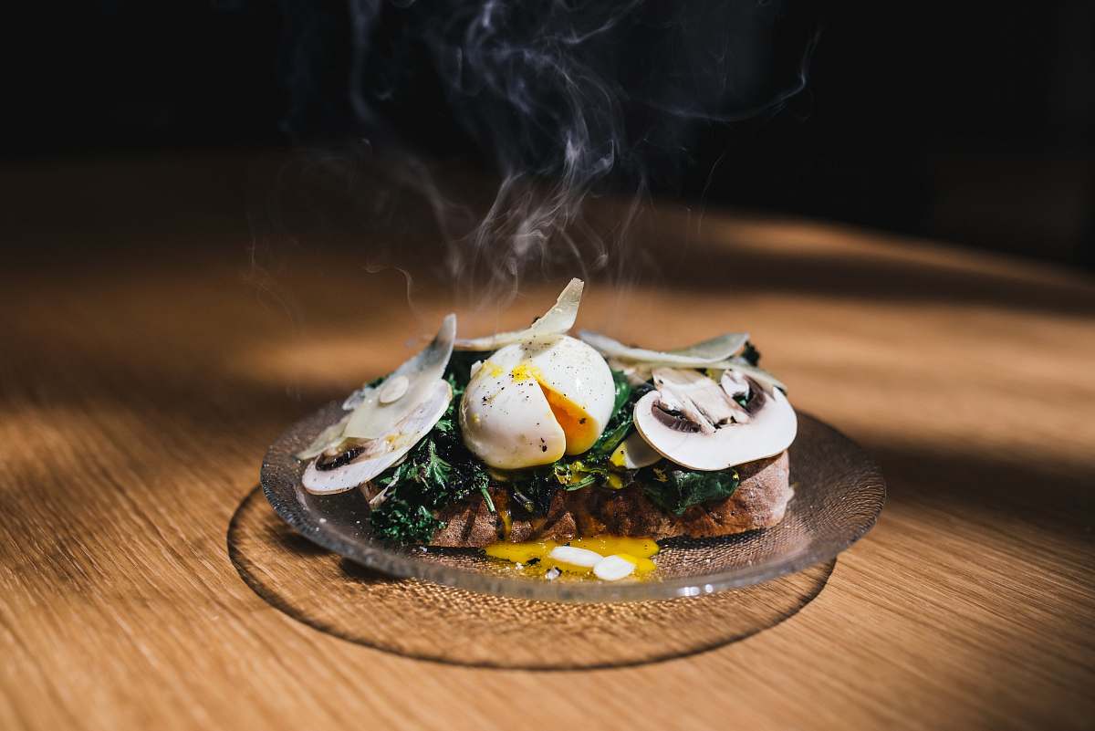 egg meat with egg and vegetable on top mushroom