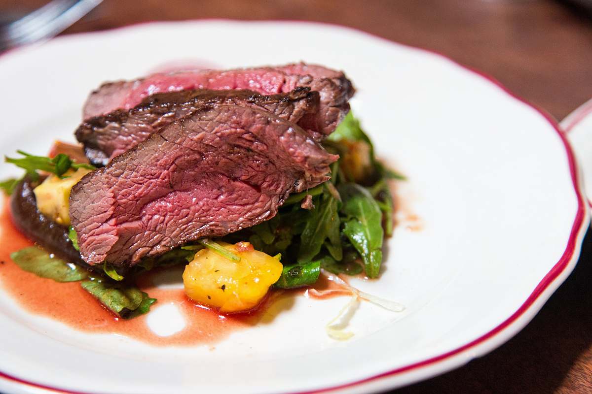 steak medium rare sliced steak in white ceramic plate dish