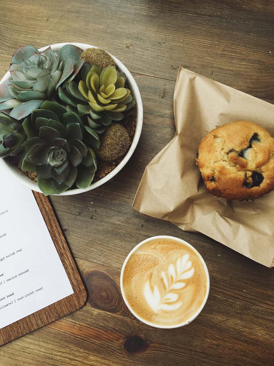 coffee muffin served on brown paper cup