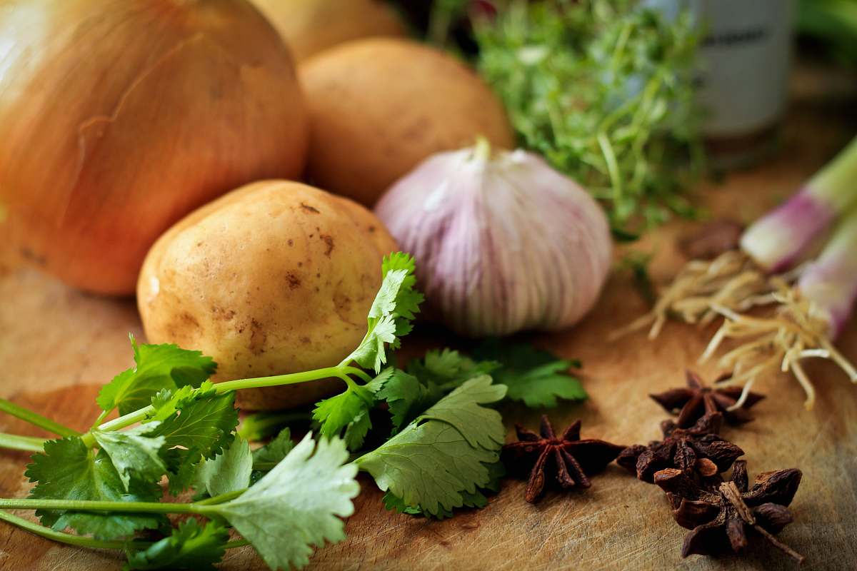 vegetable onions and potato on table garlic