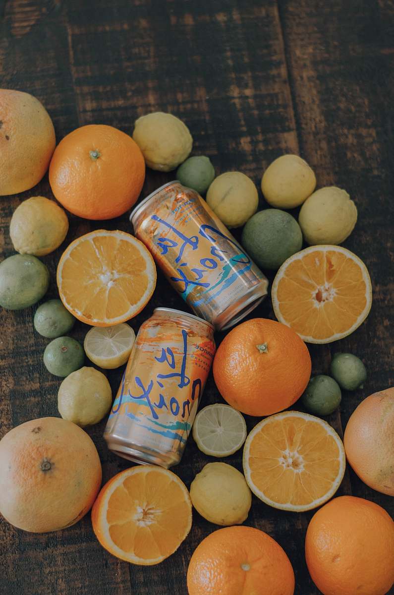 fruit orange and citrus fruits and La Croix cans citrus fruit