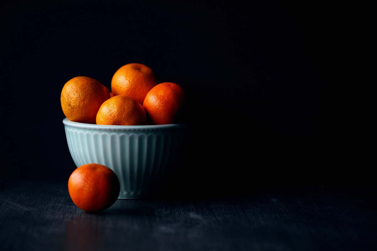 fruit orange fruit in white ceramic bowl plant