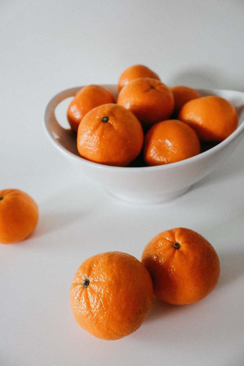 fruit orange fruits on white bowl plant