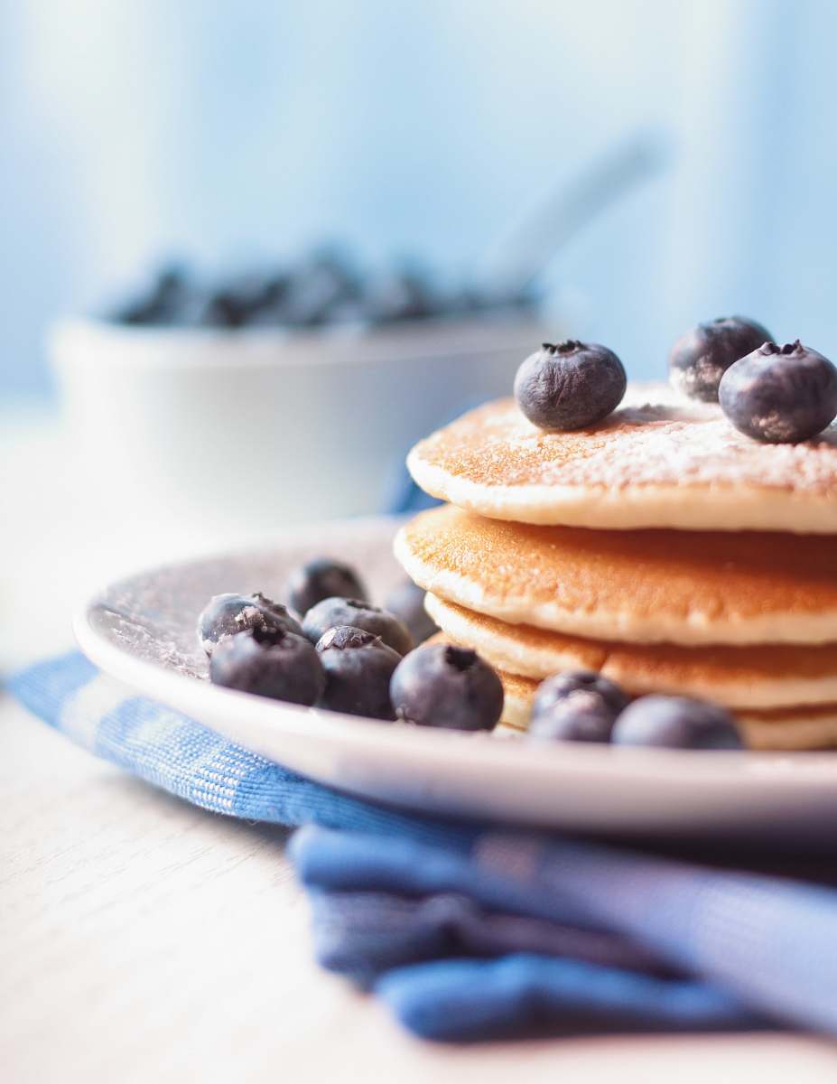fruit pancake on plate with berries blueberry