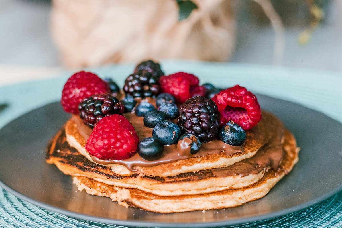 bread pancake with raspberries and blue berries toppings pancake
