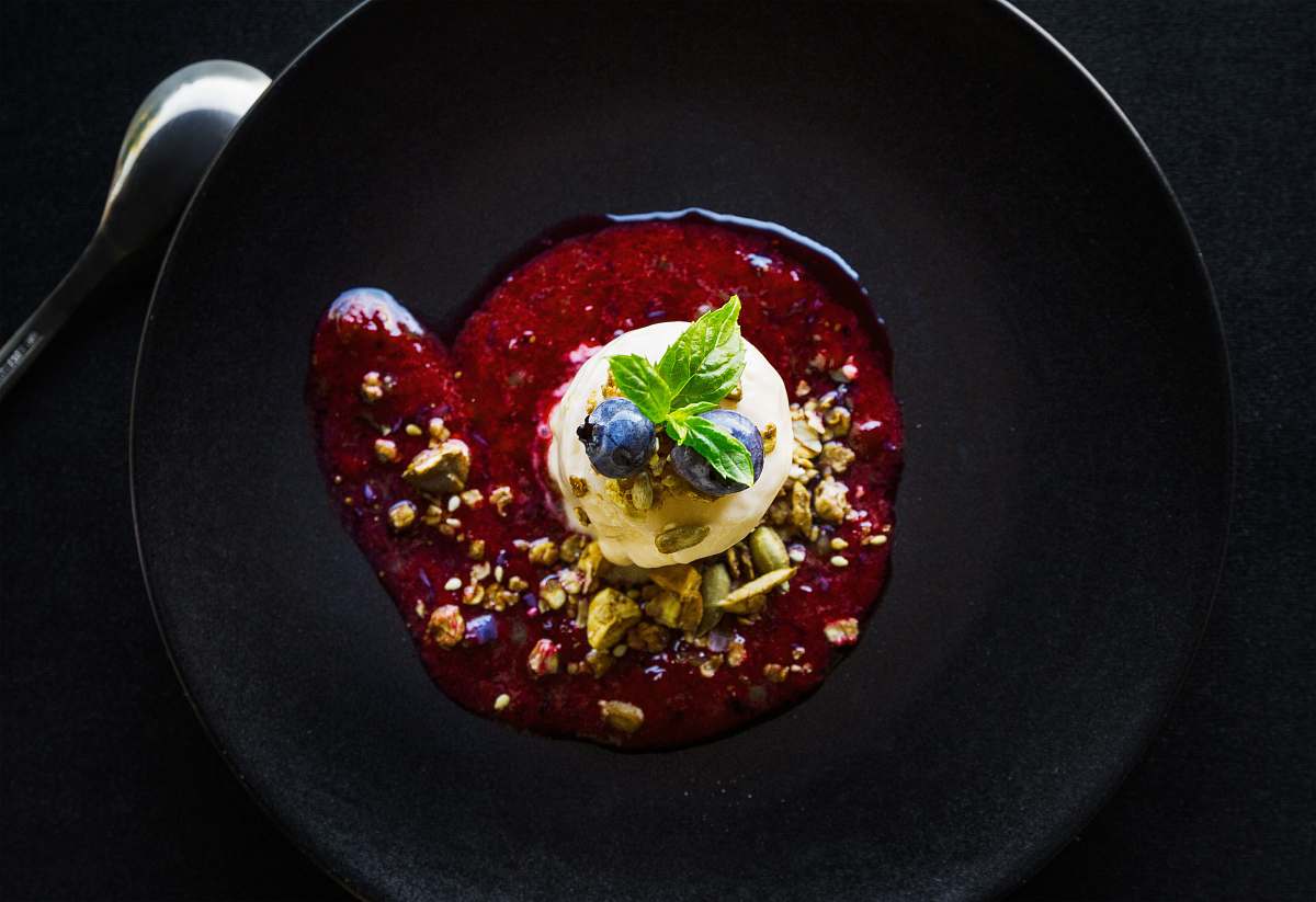 plate pastry with blueberry topping and sauce on plate blueberry