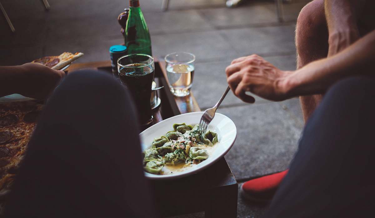 meal person eating vegetable dish dinner