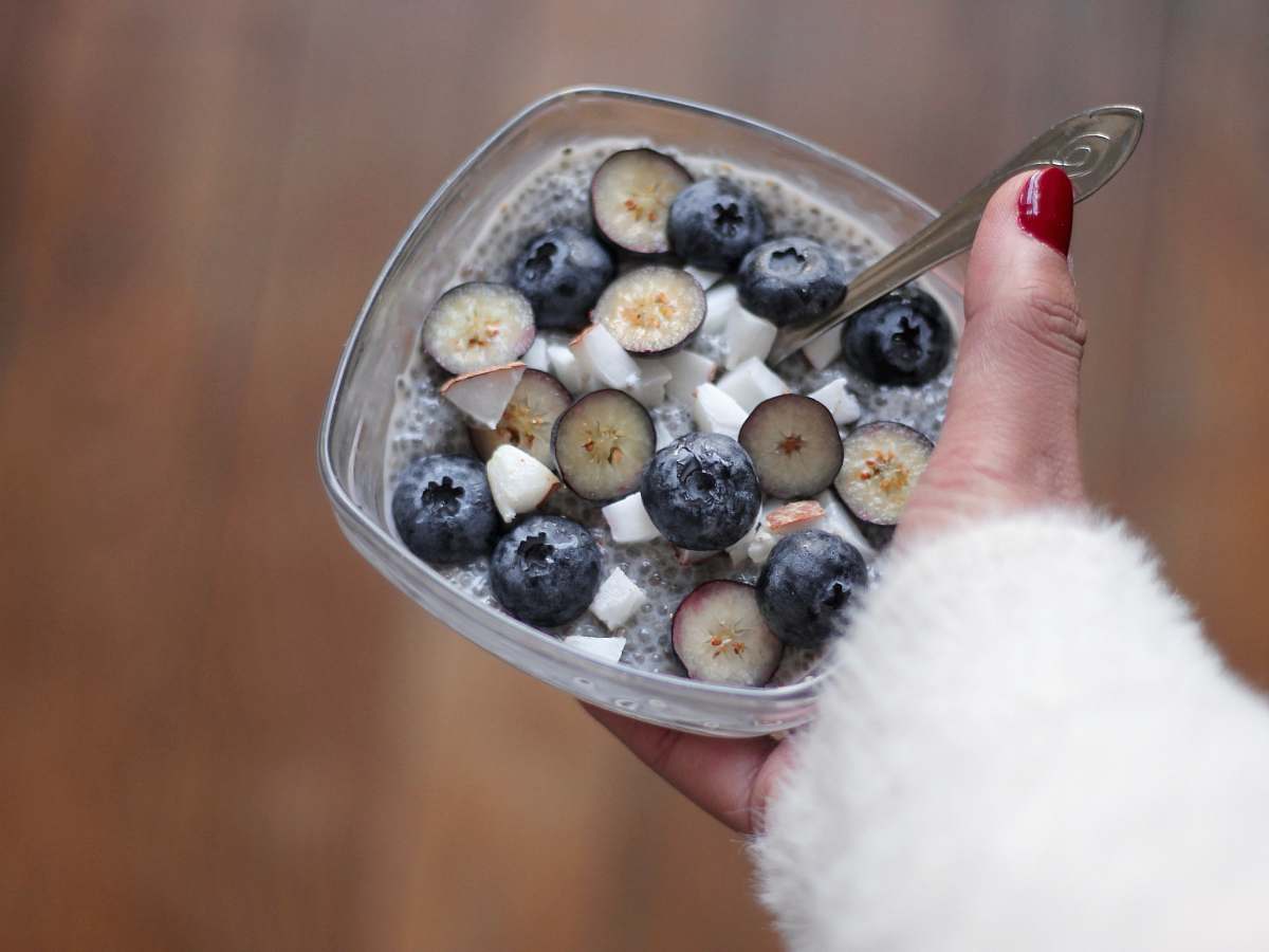 fruit person holding blackberry dessert blueberry