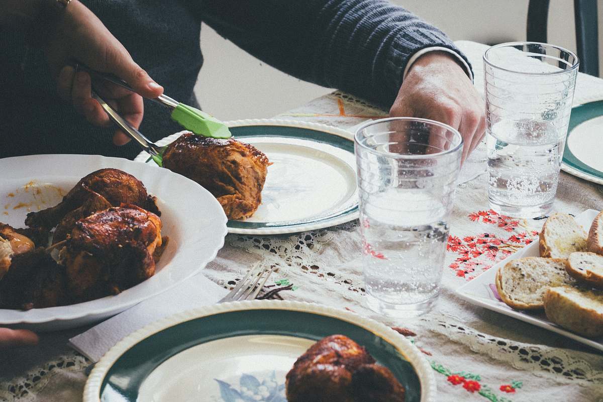 meal person holding cooked food with tongs dinner