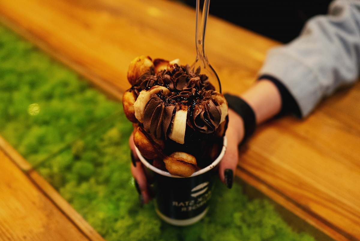 sweets person holding cup confectionery