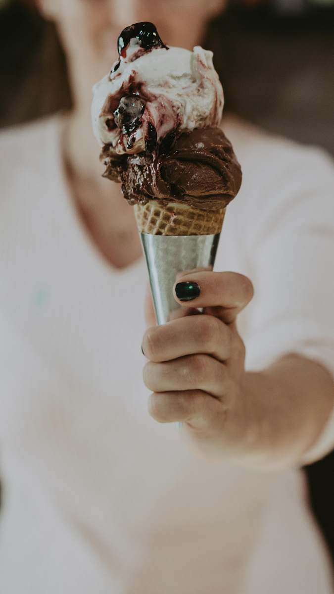 cream person holding ice cream creme