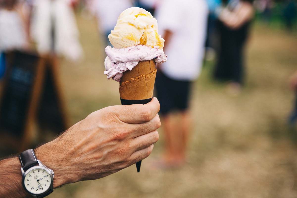 person person holding ice cream on cone ice cream