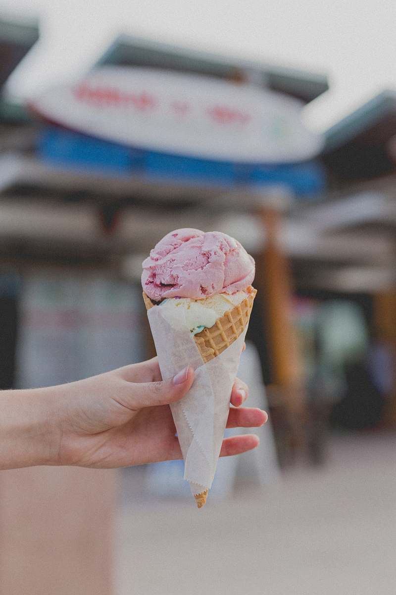 cream person holding strawberry ice cream ice cream