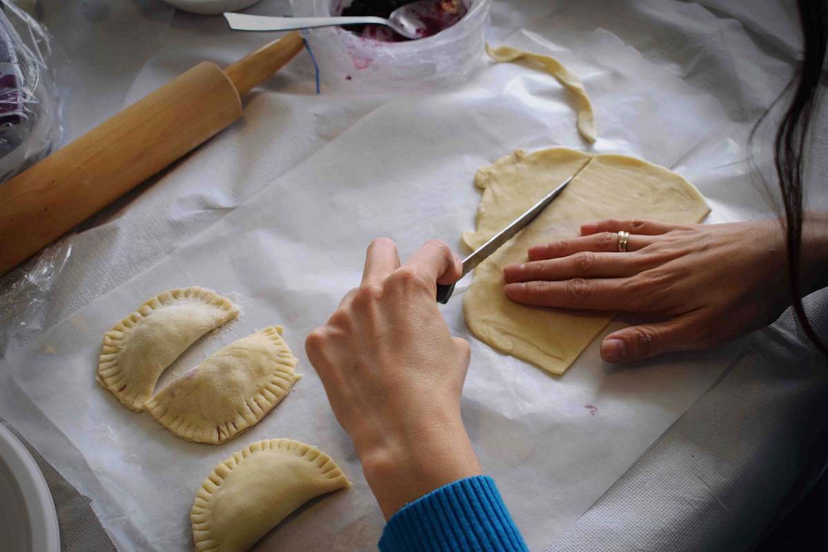 pasta person making Empanadas ravioli