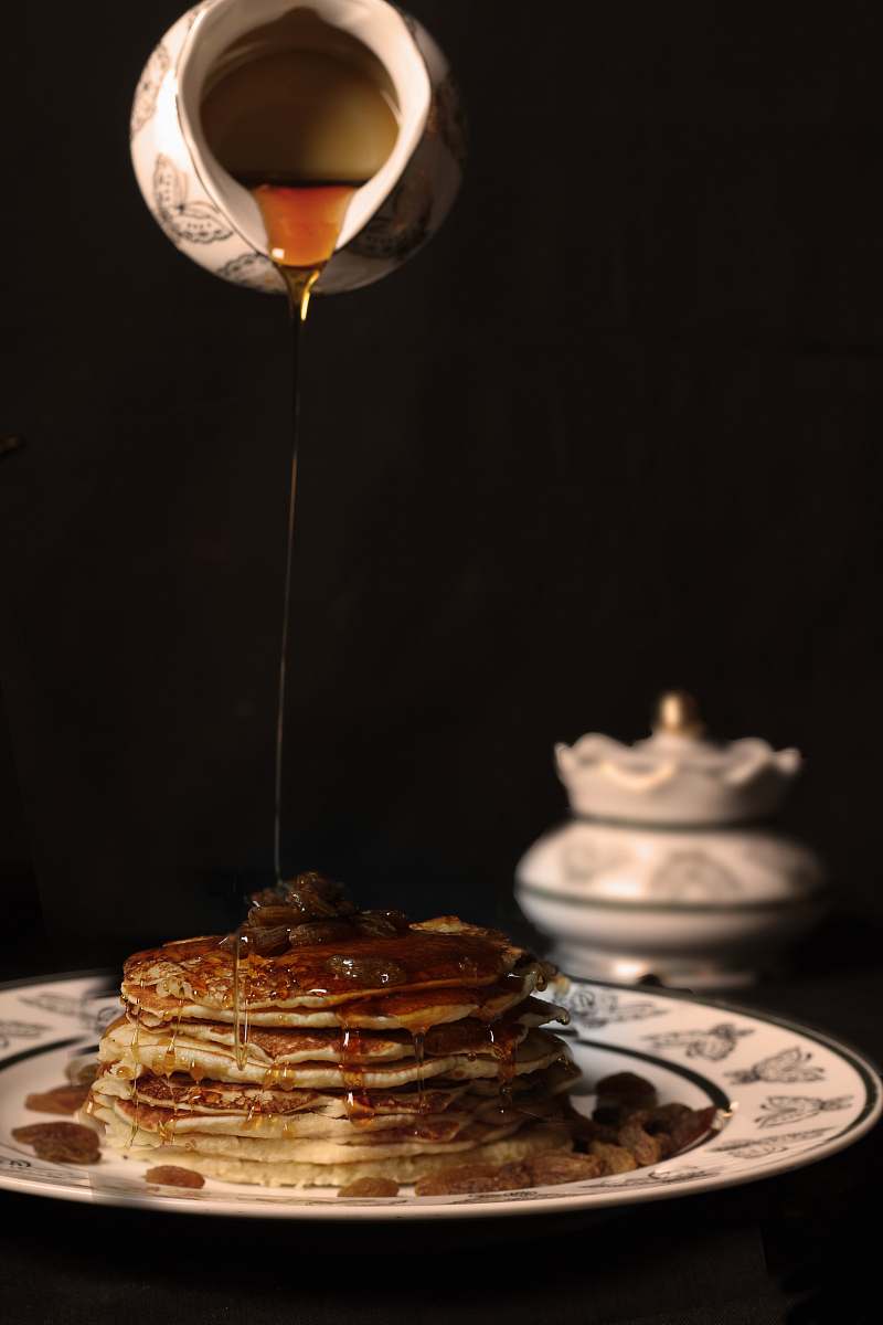 bread person pouring honey on pancakes pancake