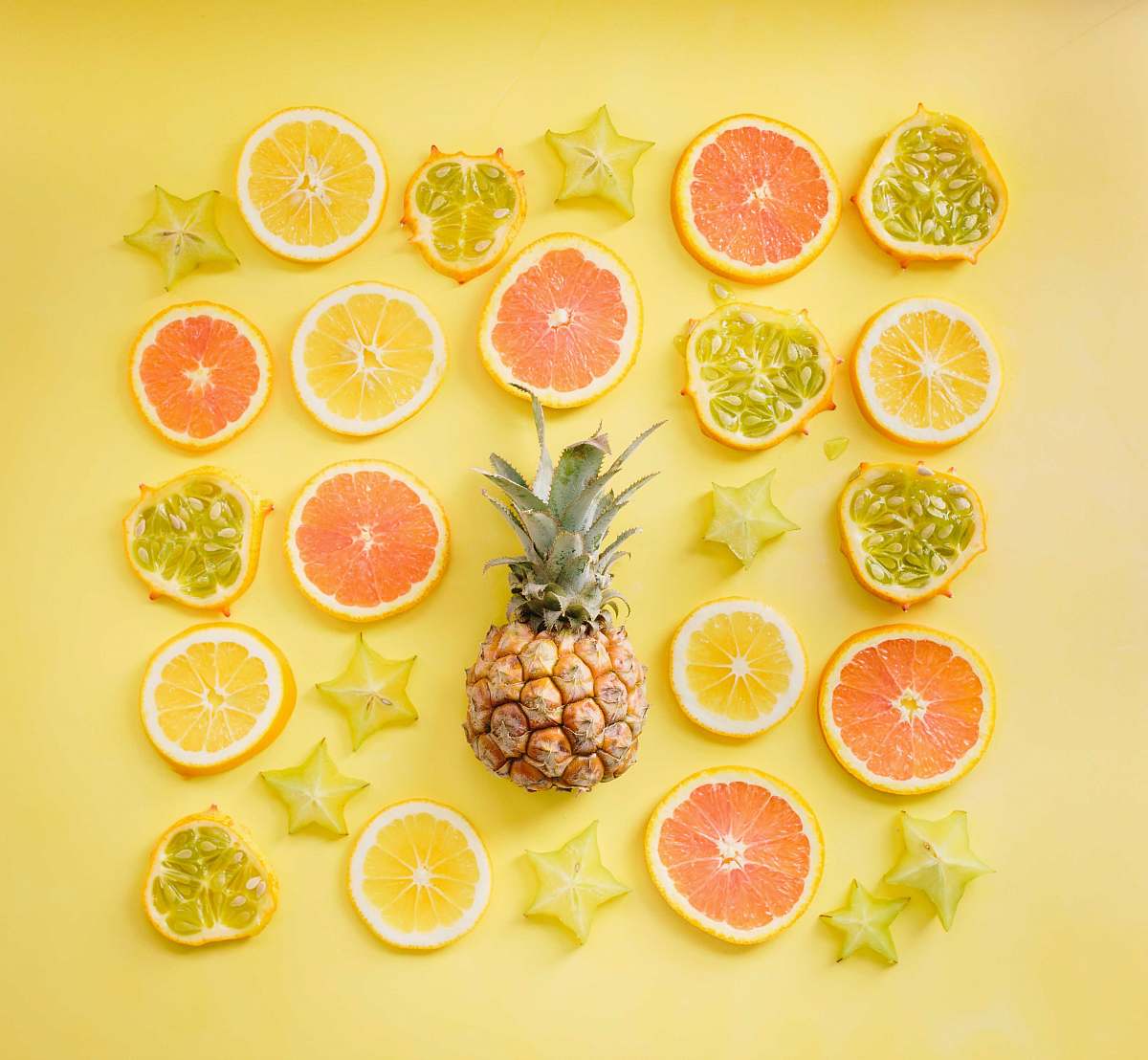 fruit pineapple surrounded by citrus fruits pineapple