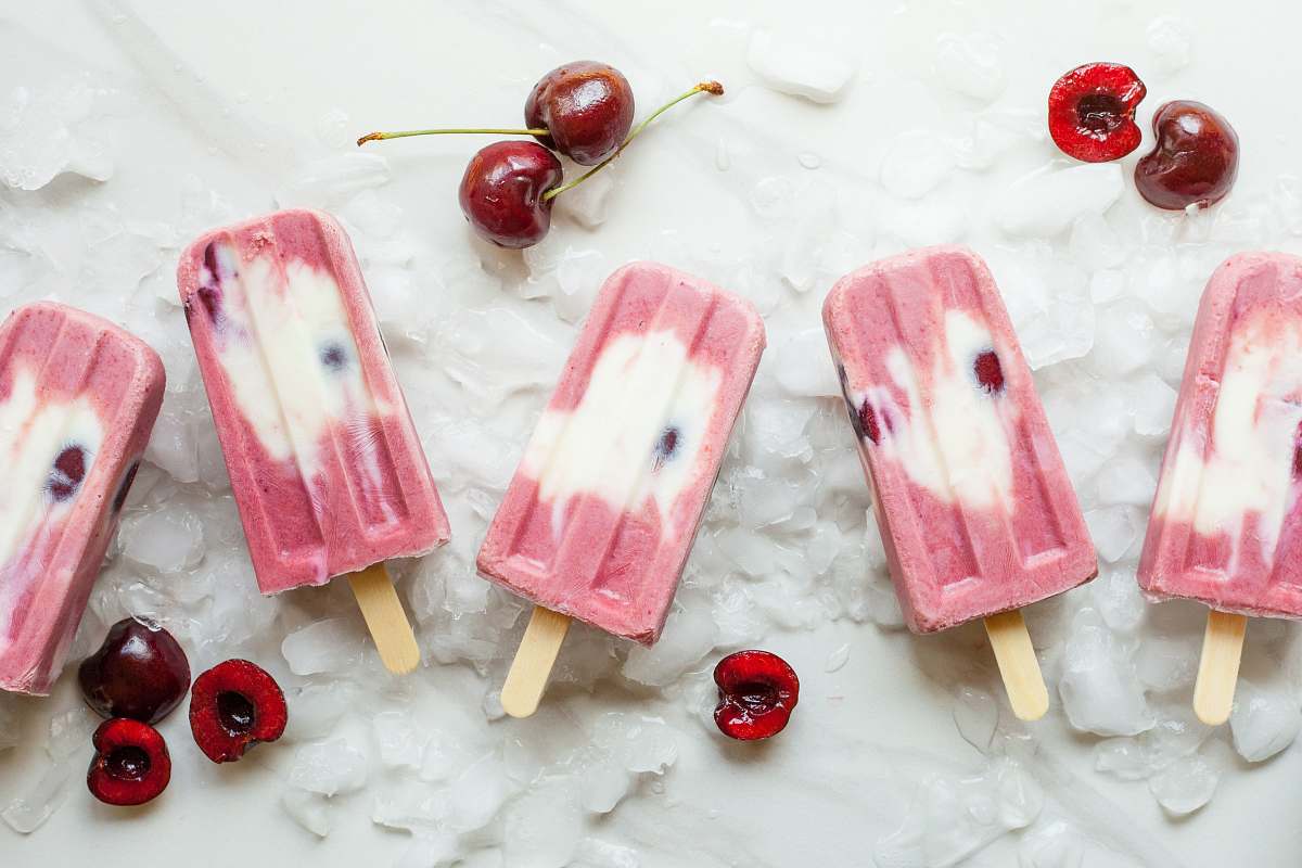 fruit pink Popsicle with cherries on ice cherry