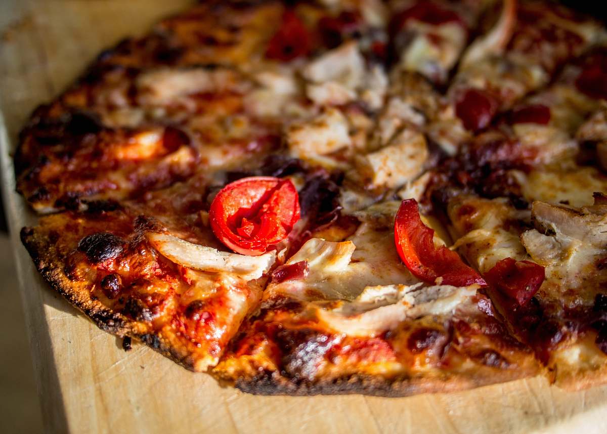 pizza pizza on wooden board tomato