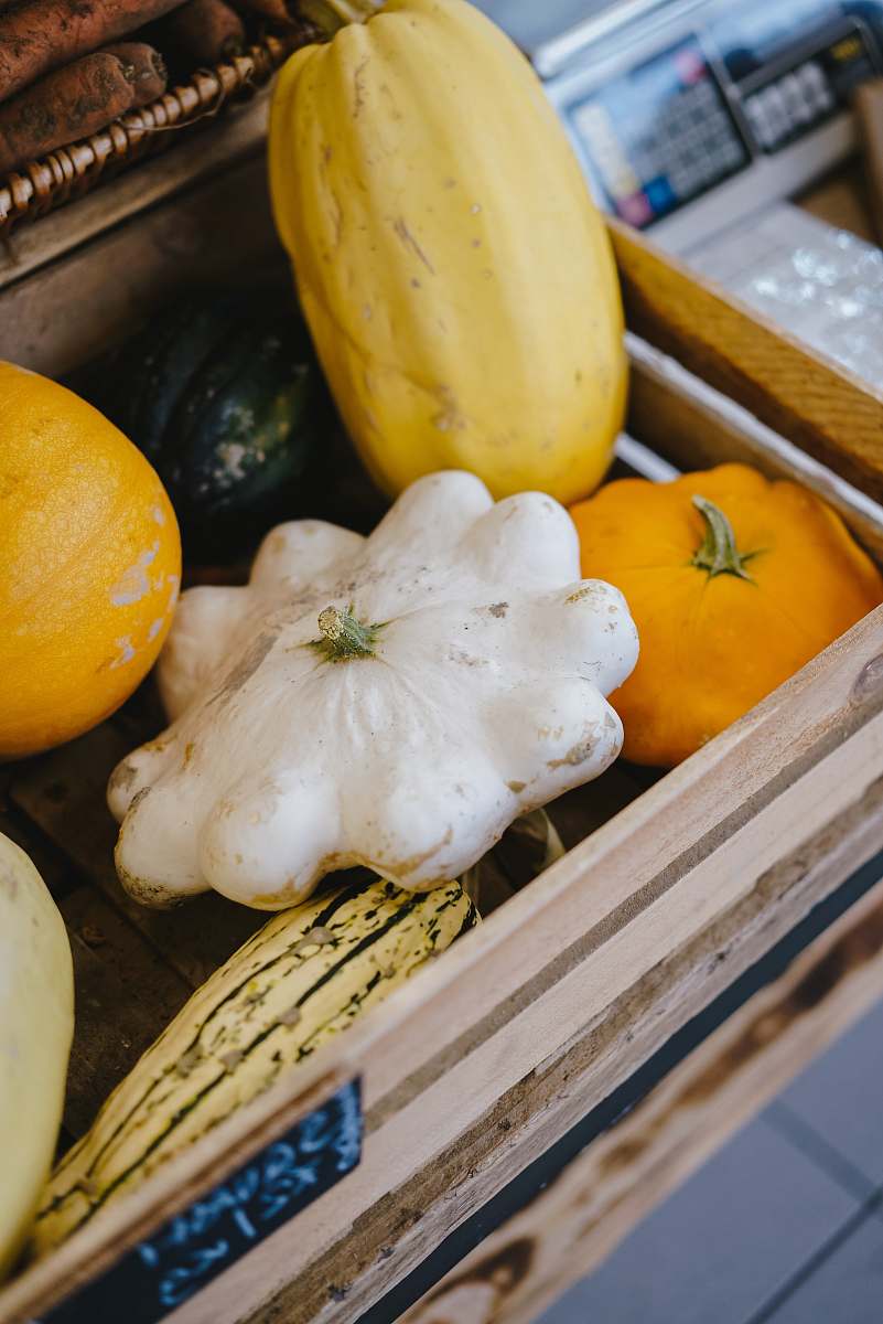 fruit pumpkins on gray wooden crate banana