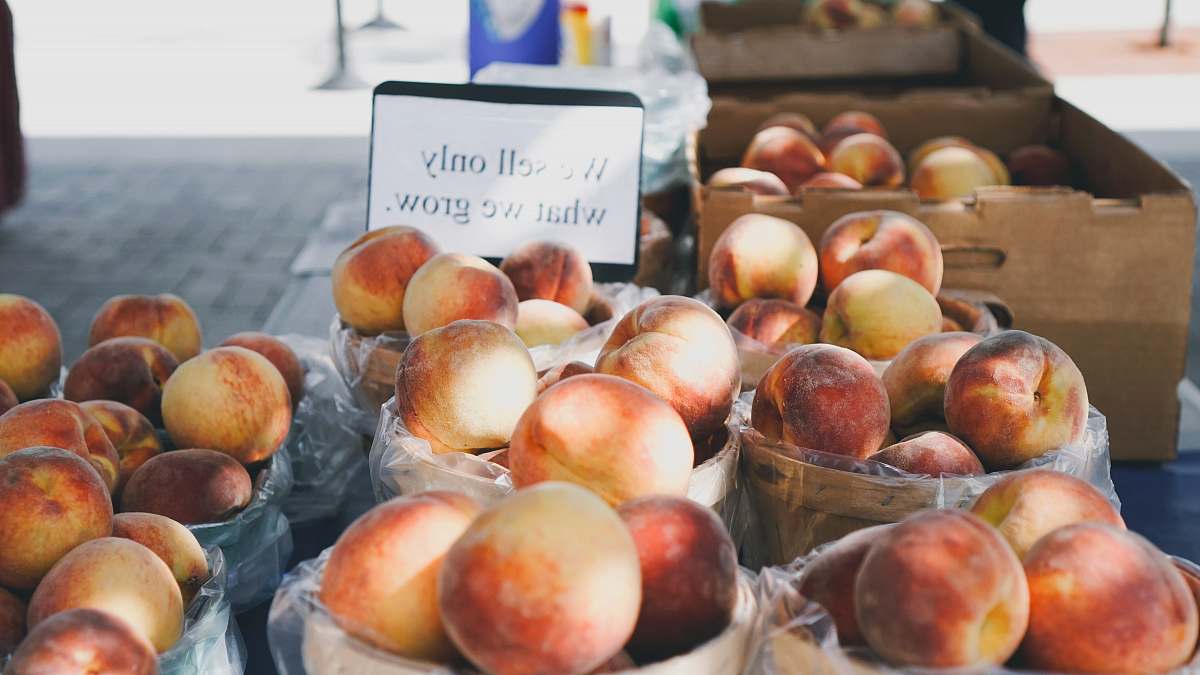 peach red and white fruits lot on basket flora