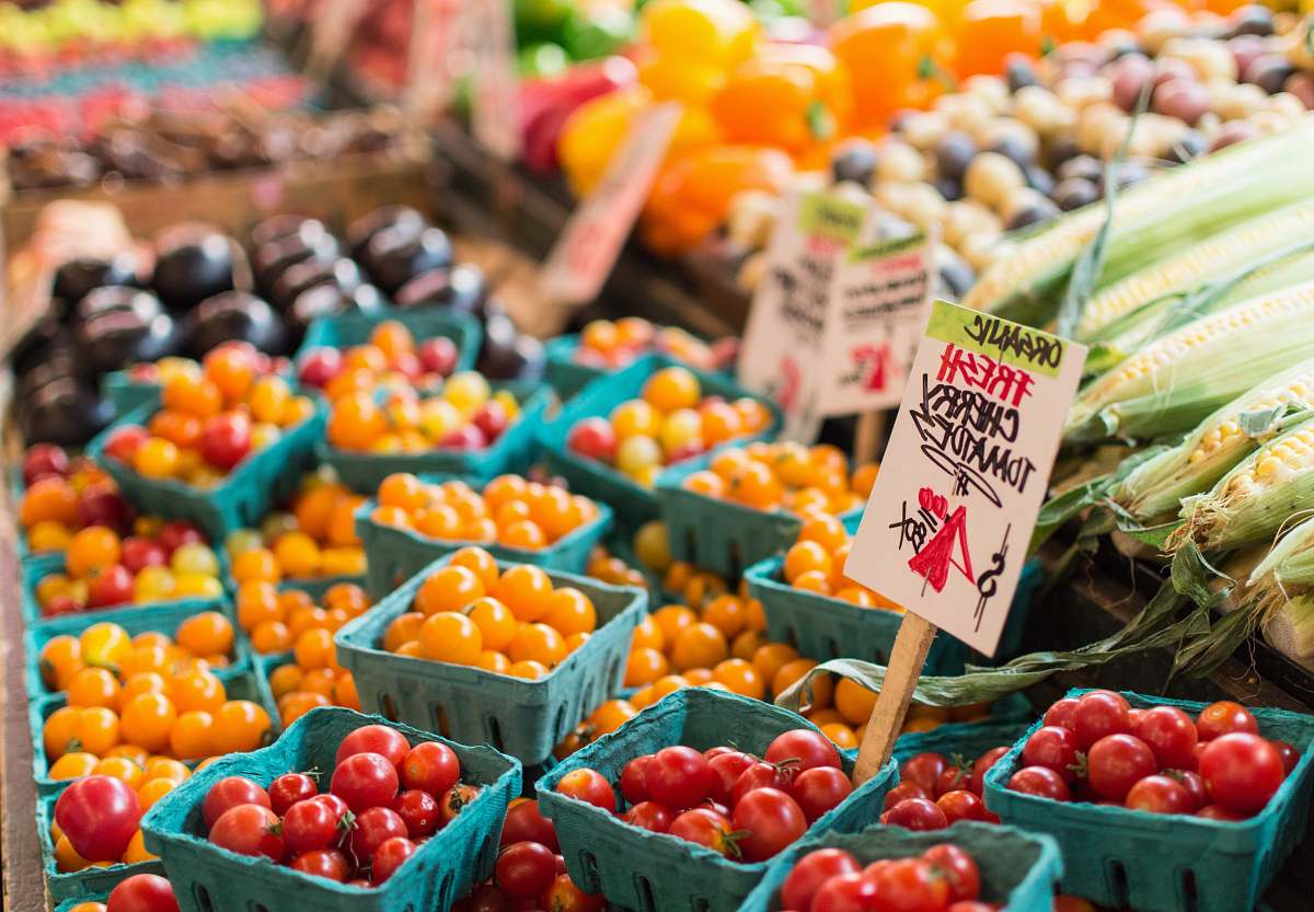 produce red tomato lot on blue baskets market