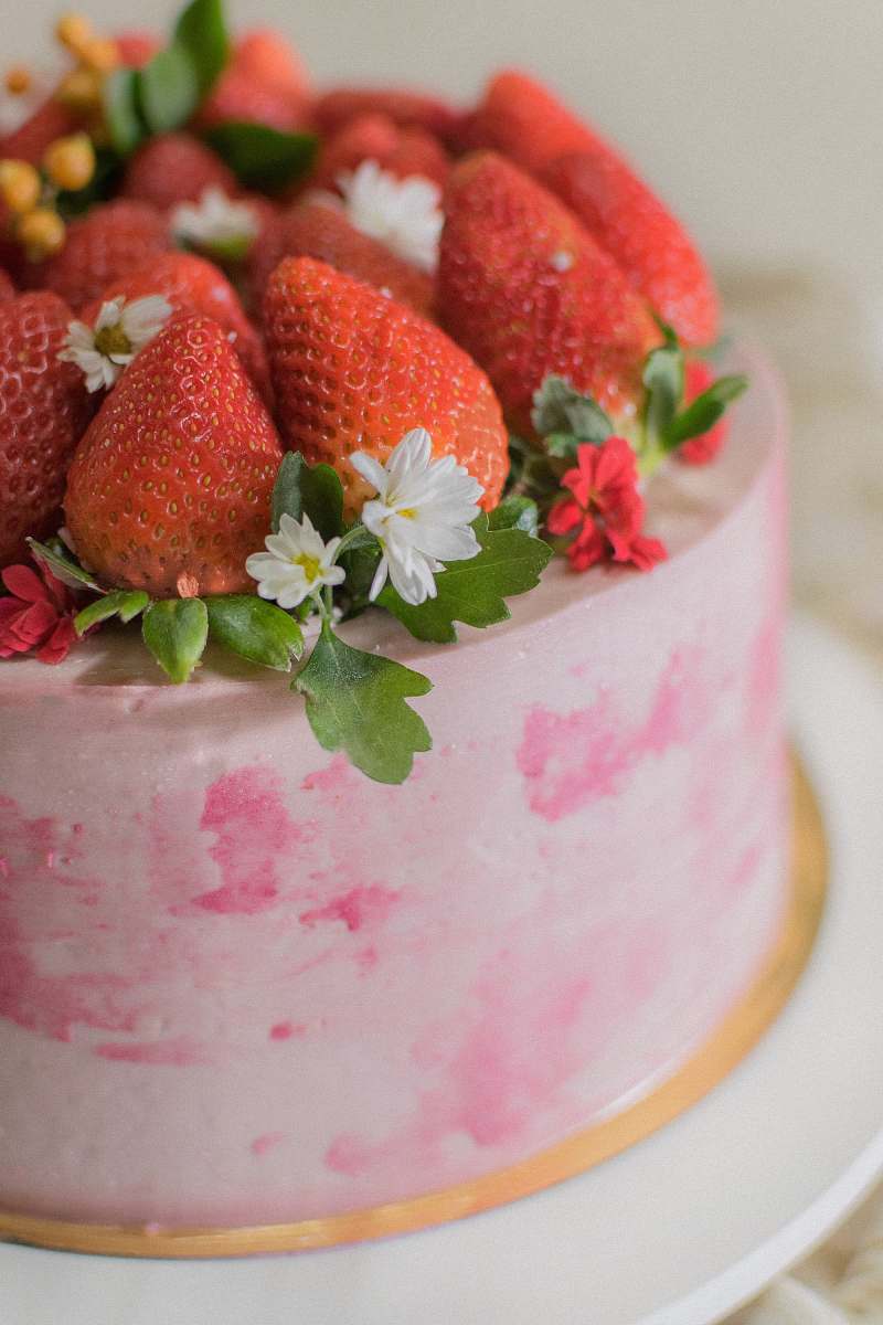 plant round cake with strawberries on top strawberry