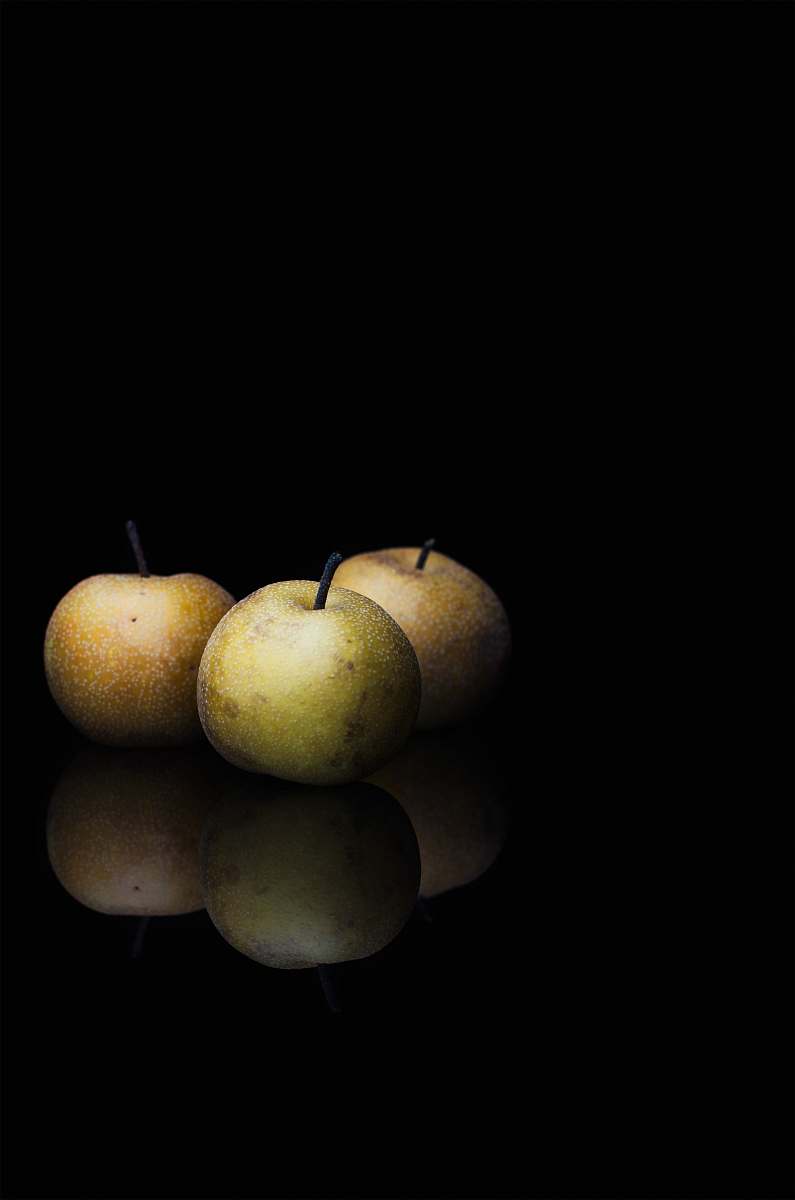 fruit round fruits in dimmed area pear