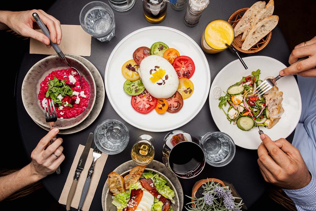 meal round white plate with sliced vegetables egg