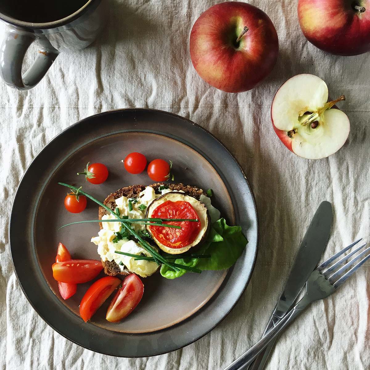 apple sandwich with cream and tomatoes on plate flora