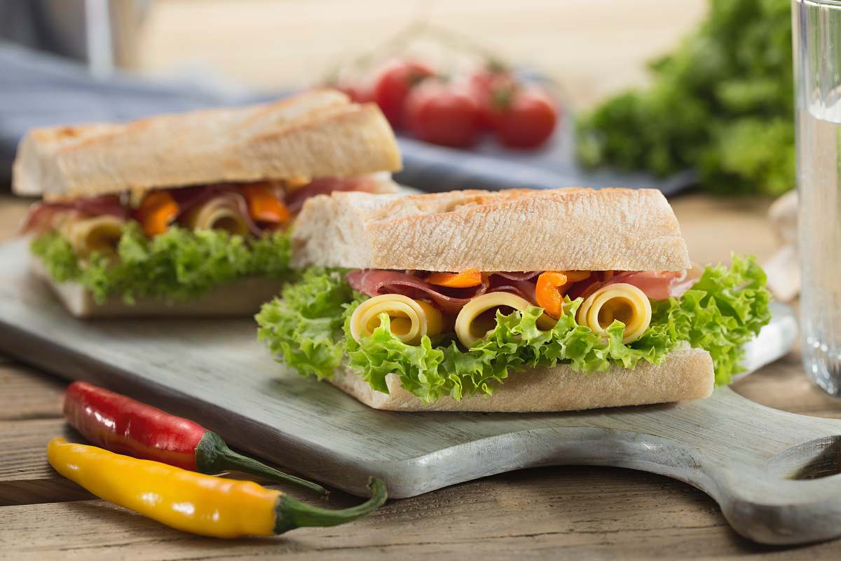 sandwich sandwich with lettuce and cheese served on chopping board warsaw