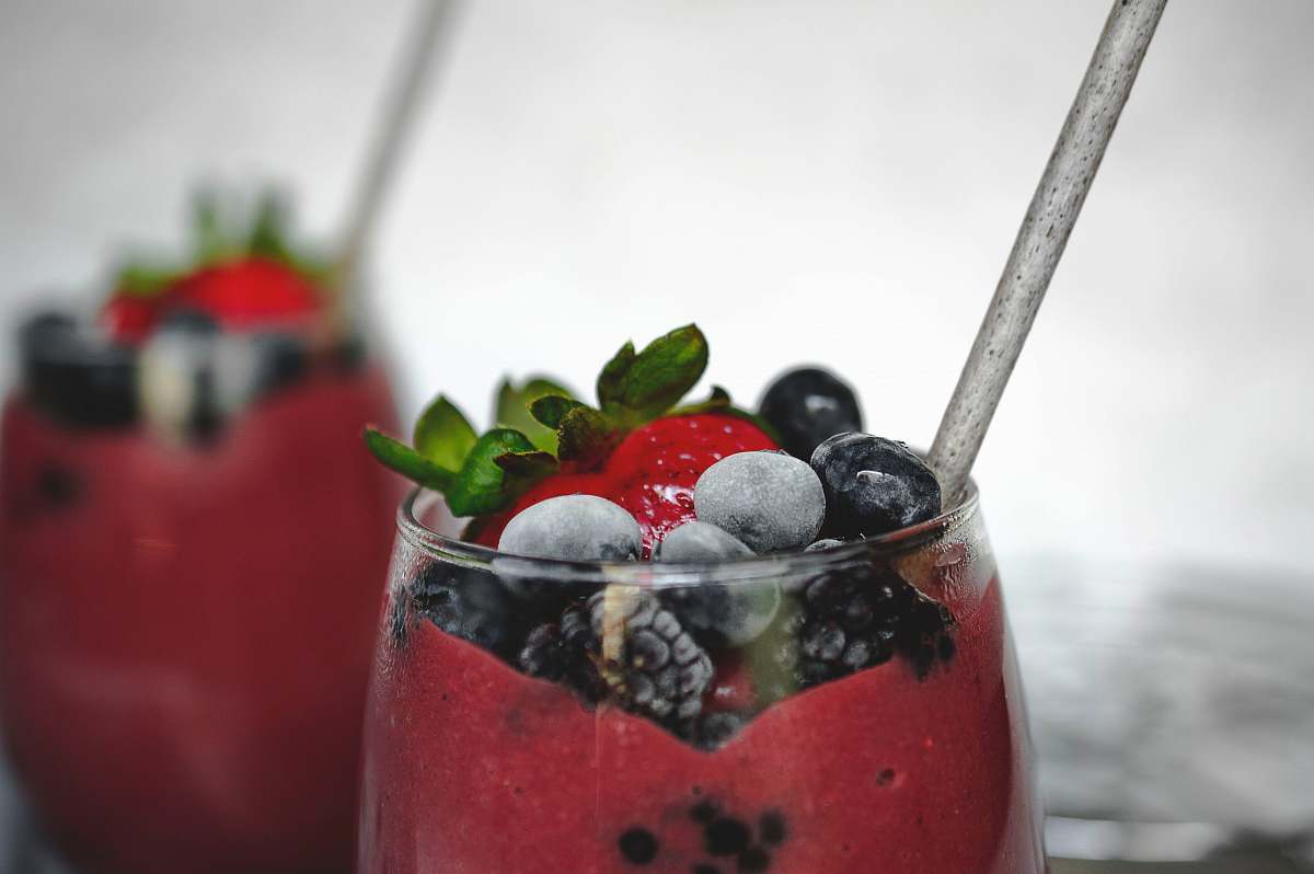 fruit selective focus photography of glass of strawberry drink plant