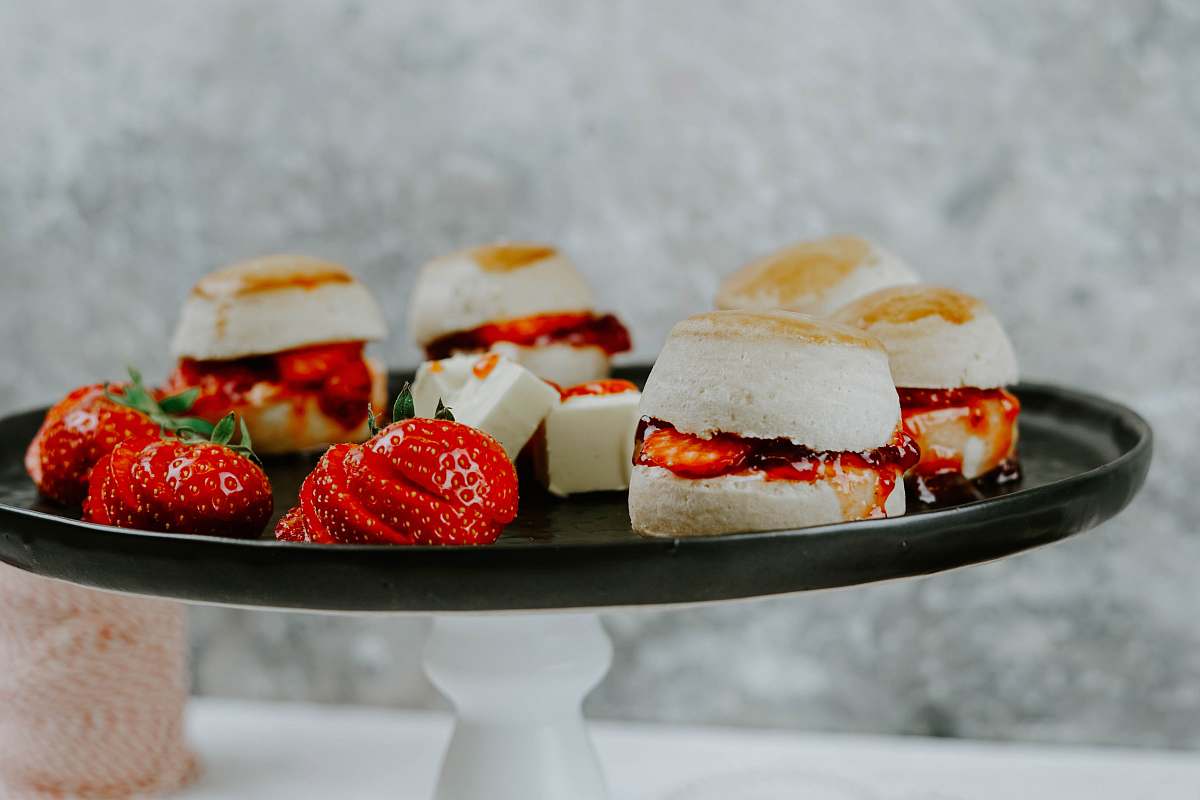 burger selective focus photography of pastry and strawberries on plate sweets