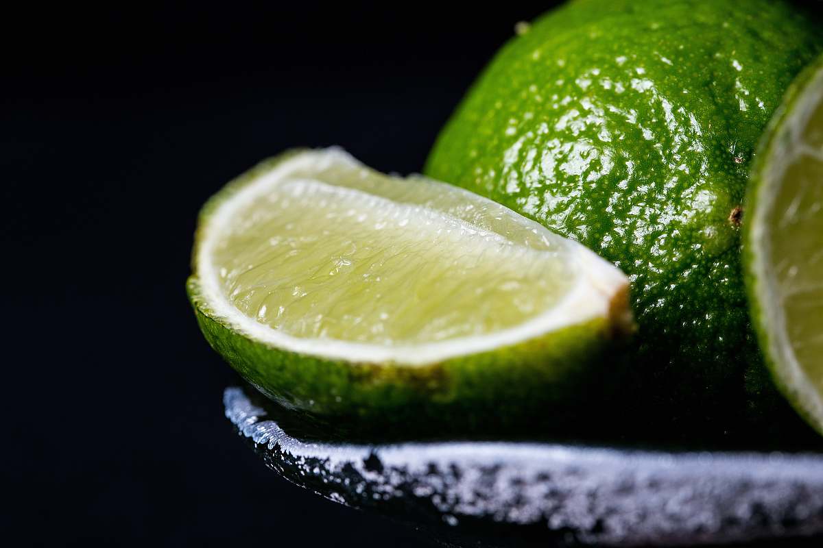 fruit sliced lime on grey bowl lime