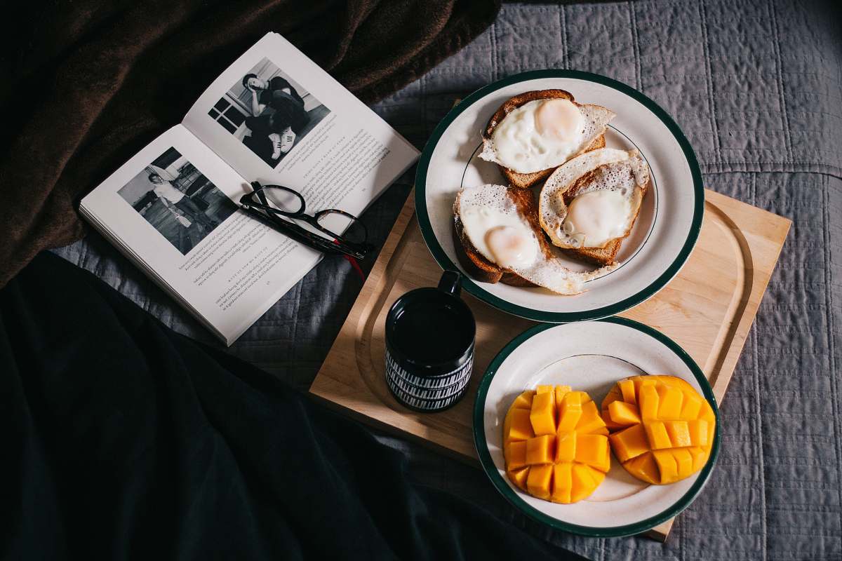meal sliced mangoes served on white ceramic plate breakfast