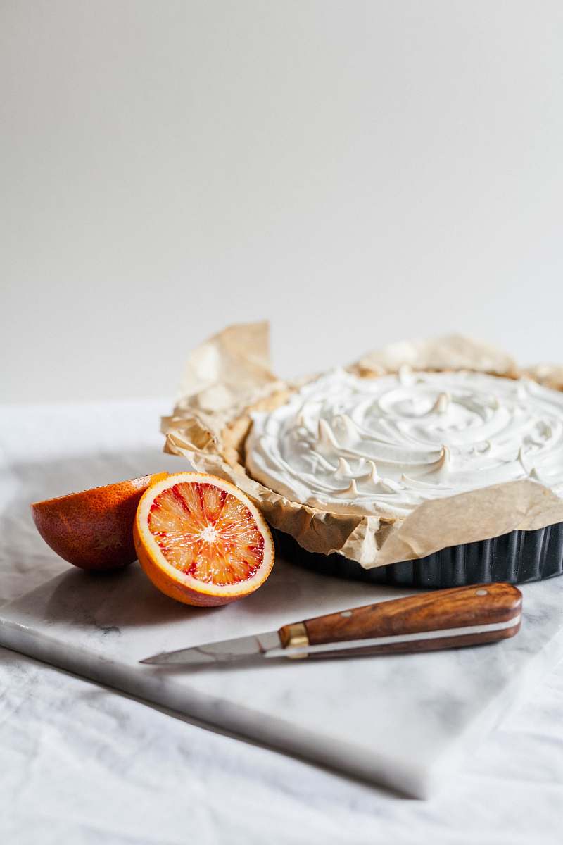 orange sliced orange fruits and white cupcake pastry