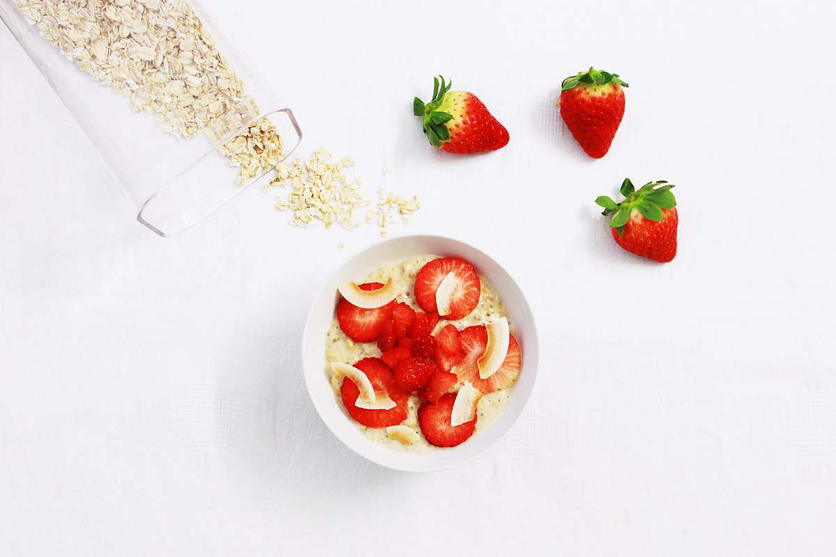 fruit sliced strawberries on white cup strawberry