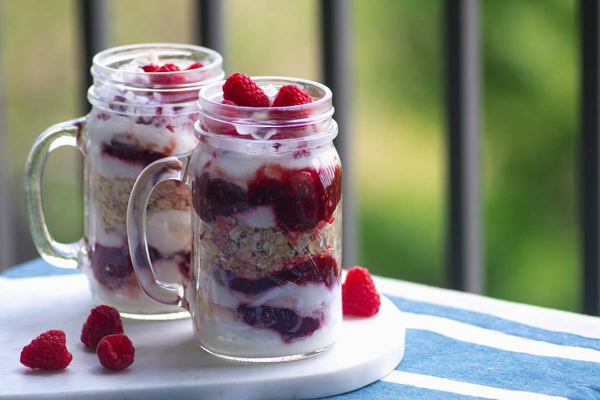 raspberry strawberry ice cream in clear glass jars produce