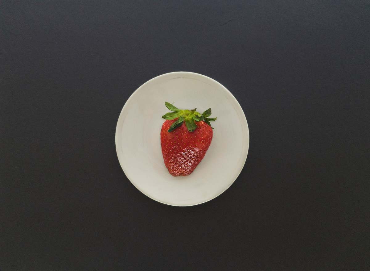 fruit strawberry on white saucer plant