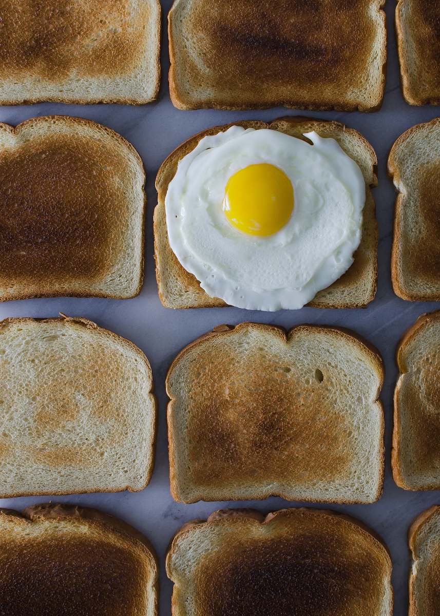 breakfast sunny side up egg on toasted breads toast