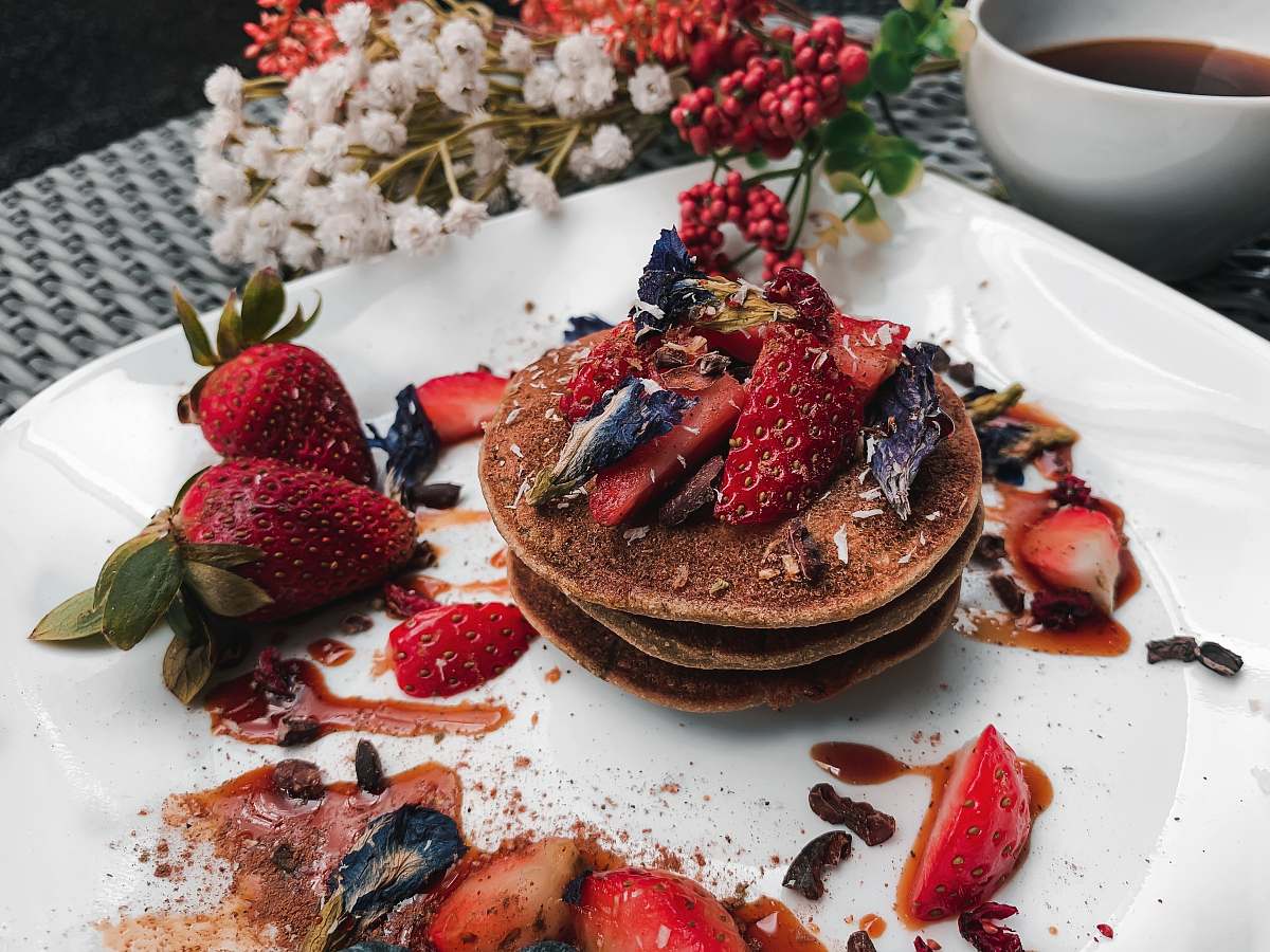 bread three pancakes topped with berries pancake