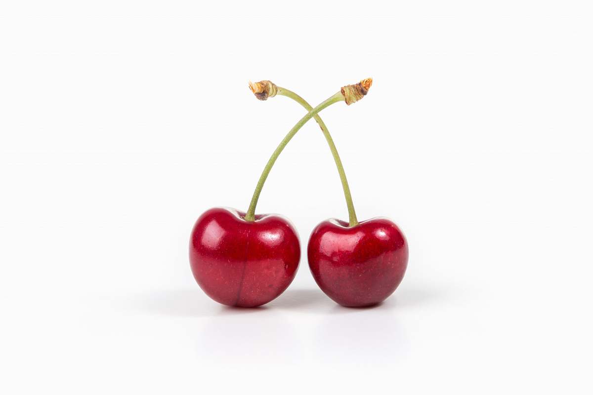 fruit two cherries on white surface cherry