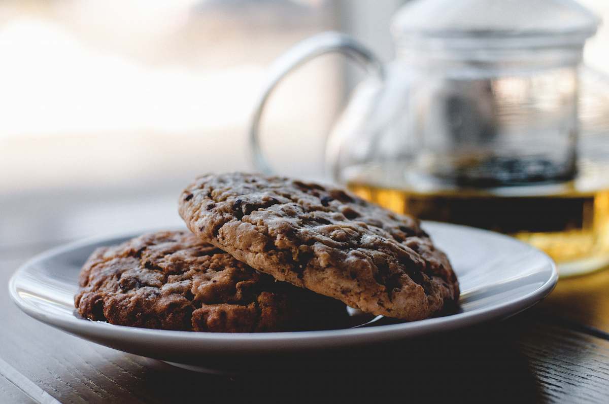 cookies two cookies on white ceramic plate tea