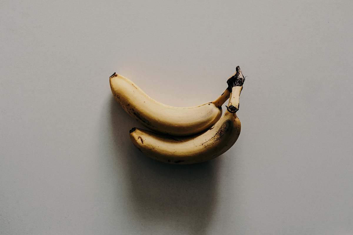 fruit two yellow banana on white surface banana