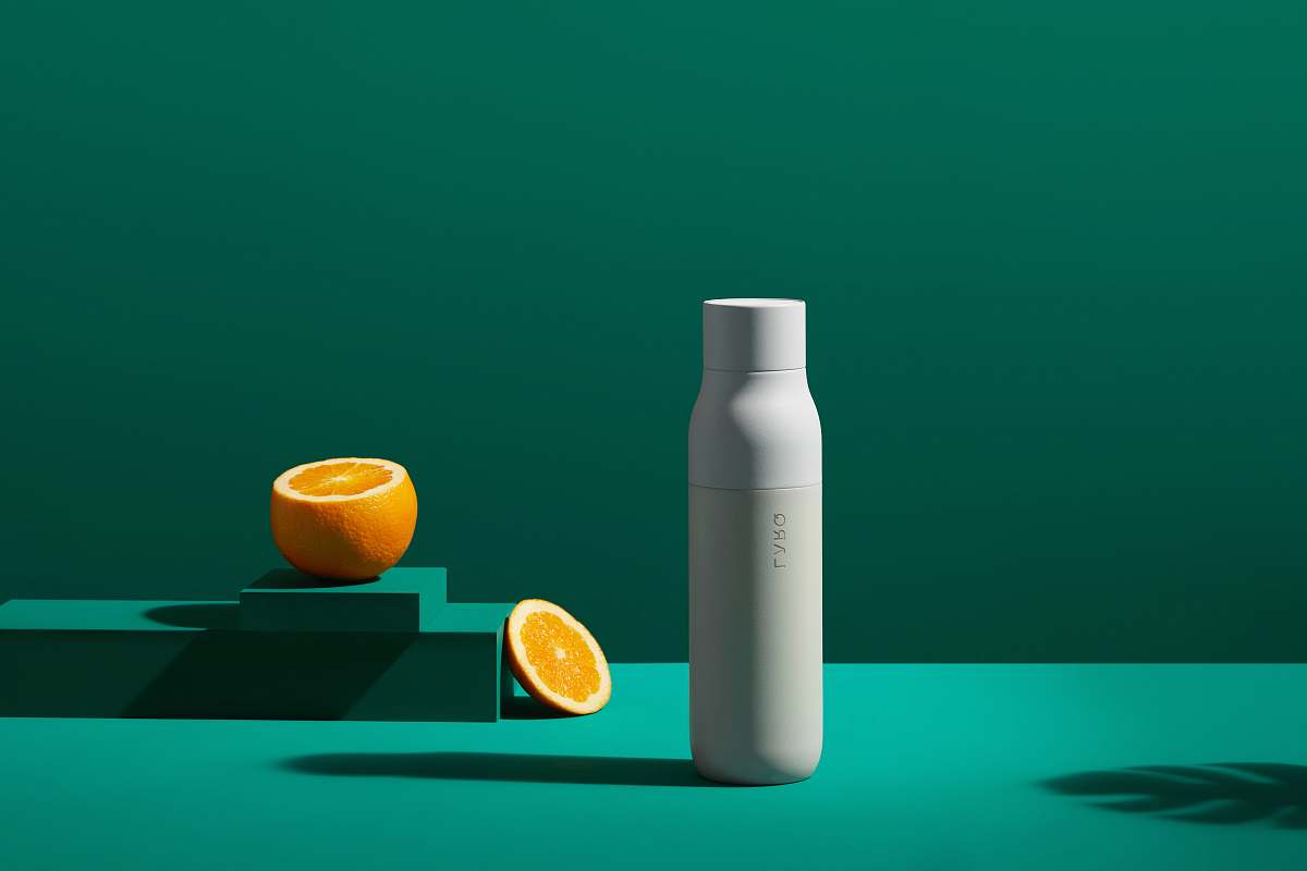 fruit white bottle near orange slice plant