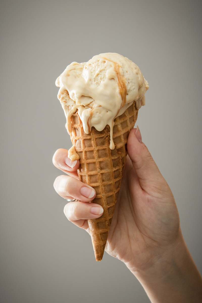 cream white ice cream on brown cone dessert