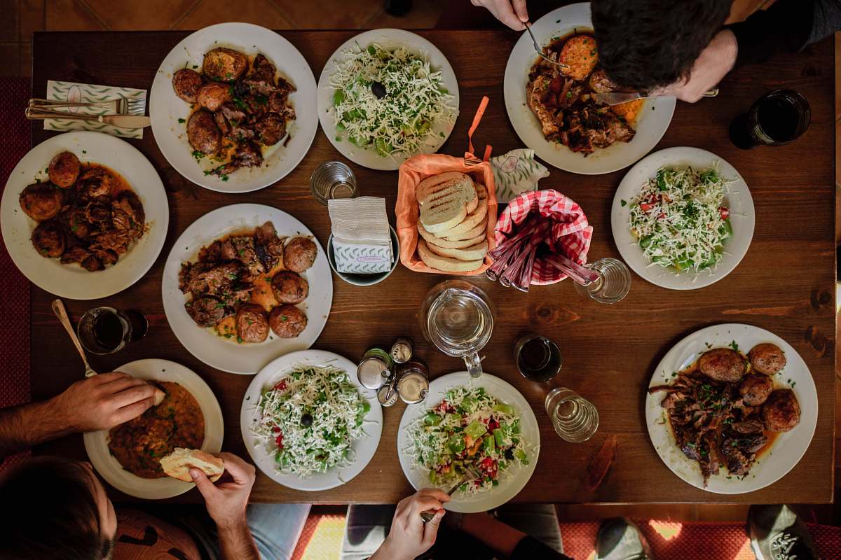 meal white plates with assorted foods table