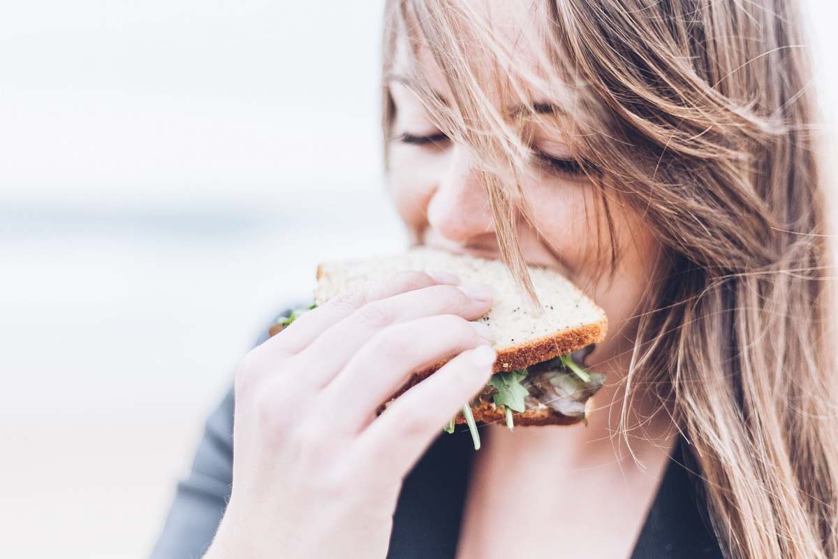 people woman eating sandwich sandwich