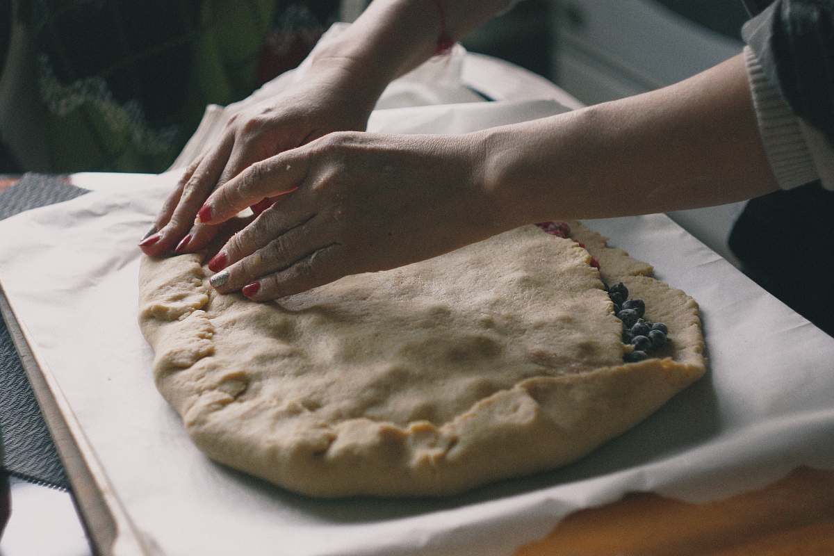 bread woman making dough on white textile pita