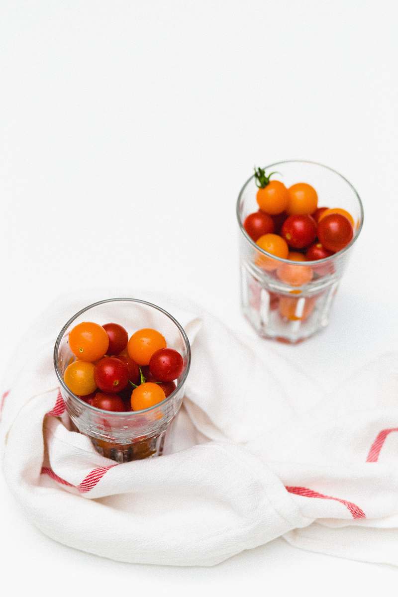 vegetable yellow and red tomatoes in glasses tomato