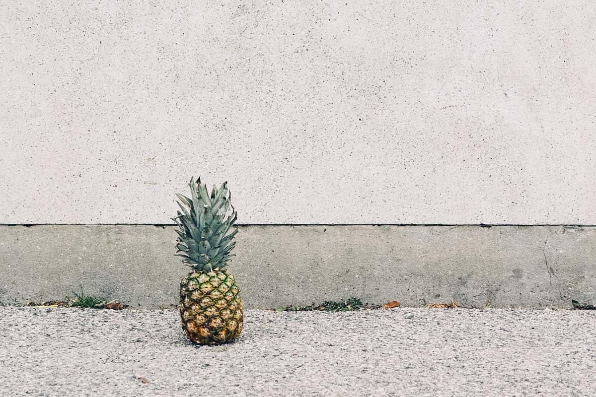 pineapple pineapple fruit beside wall food